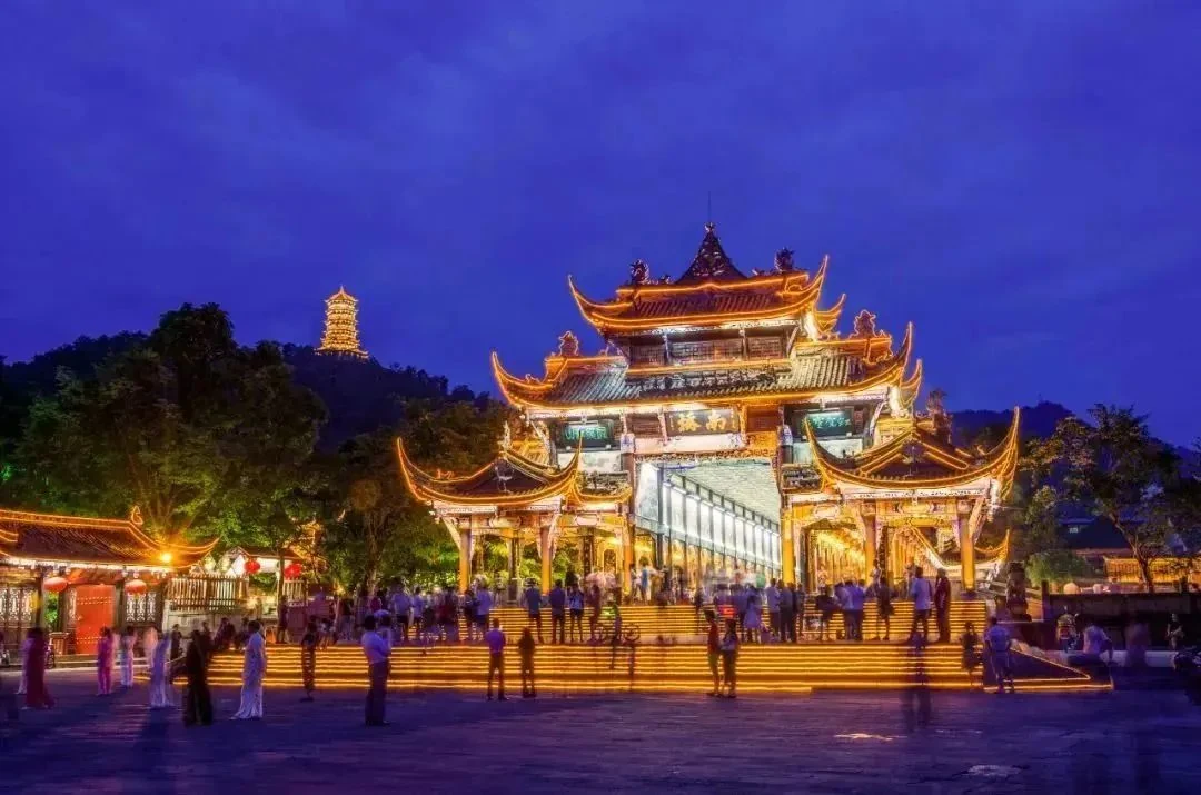 Nanqiao Bridge illuminated beside the river in Dujiangyan